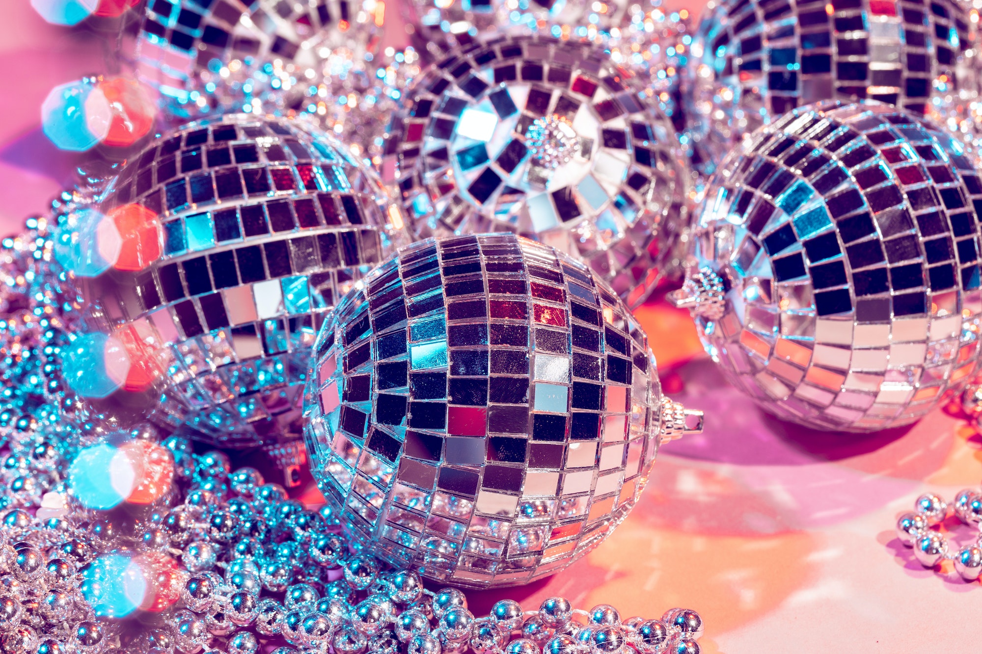 disco ball bauble on pink background. party concept